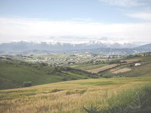 a view of a valley with mountains in the background at B&B Verdi Colline in Controguerra