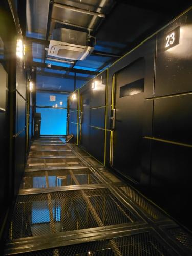 a hallway of a subway train with the door open at Hostel Joy Calle 85 in Bogotá