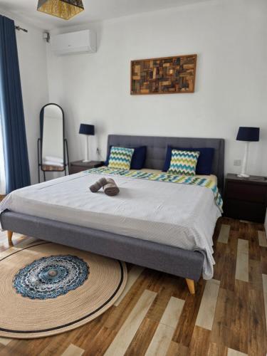 Una cama o camas en una habitación de Labrize Apartment
