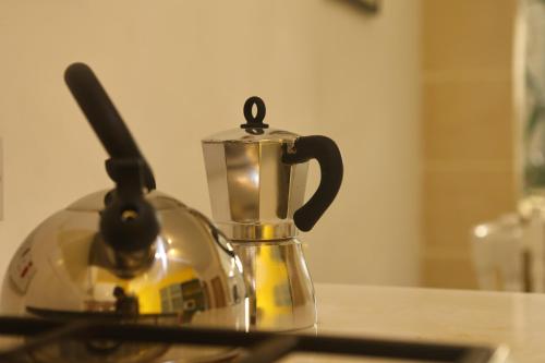 Adinkra Suitsにあるコーヒーまたはお茶