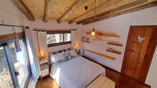 Giường trong phòng chung tại Cabañas Bahia Serena