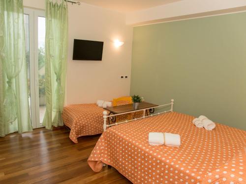 Postel nebo postele na pokoji v ubytování B&B Verdi Colline