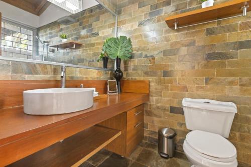 a bathroom with a sink and a toilet at Villa with golf course views in San Rafael del Yuma