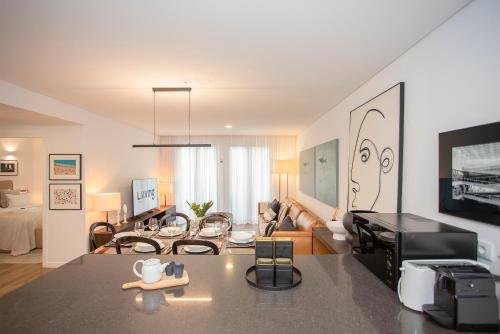 a living room with a couch and a table at Liiiving in Gaia - Cooper Residence Apartment II in Vila Nova de Gaia