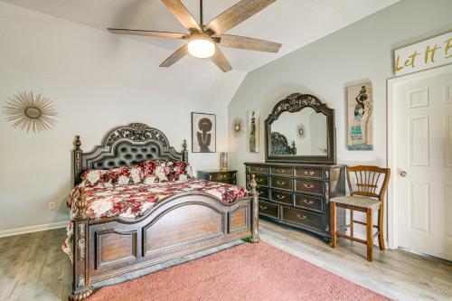 a bedroom with a bed and a dresser and a ceiling fan at Residential Cul-De-Sac Suburban Memphis Hideaway! in Lakeland