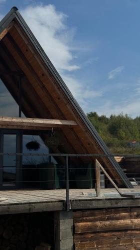 a roof of a house with a wooden deck at Shalash 1 in Velikiye Lazy