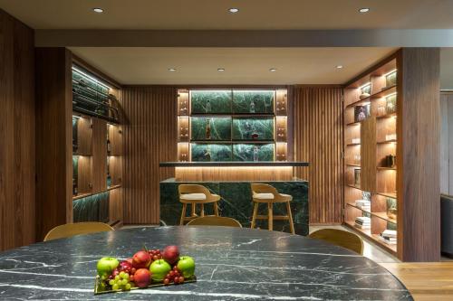 a dining room with a table with fruit on it at Presidente InterContinental Monterrey by IHG in Monterrey
