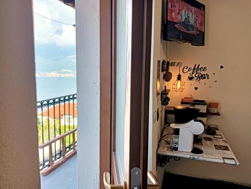 a balcony with a view of the ocean at Lake Como Windrose - Rosa dei Venti in Bellano