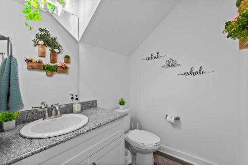 a bathroom with a sink and a toilet at Pet Friendly 3BR House in Charlotte in Charlotte