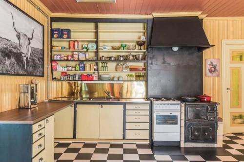a kitchen with a stove and a counter top at Beautiful house in Fränsta in Fränsta