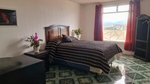 Ένα ή περισσότερα κρεβάτια σε δωμάτιο στο Los Cerezos Apartment