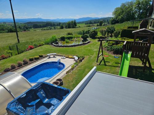 a view of a backyard with a swimming pool at Rekreační dům Štěpánka in Česká Kubice