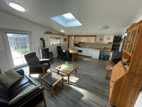 a living room with a couch and a table at Kaminstube Hof Friebe in Reken
