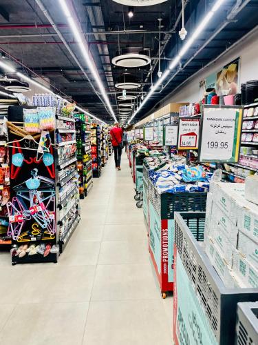 a aisle of a store with a person walking down the aisle at Porto El Sokhna Chalits In Water Front in Ain Sokhna