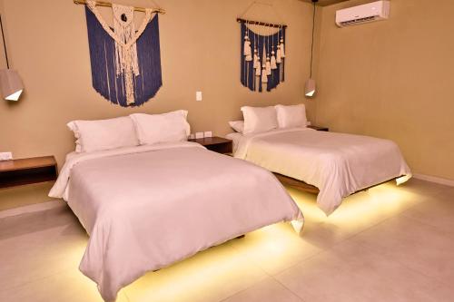 Ein Bett oder Betten in einem Zimmer der Unterkunft Hotel Scappata