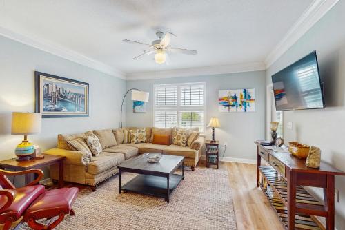 a living room with a couch and a table at Friends Delight in Calabash