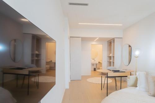 a living room with a white couch and a table at La Vista Bonita by Rent All Como in Como