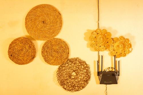 a wall with four different types of objects on it at Casa de Hospedagem Cajueiro in Jijoca de Jericoacoara