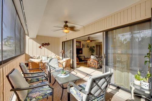 a porch with chairs and a table and a couch at Centrally Located Kailua-Kona Condo with Lanai! in Kailua-Kona