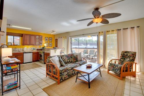 a living room with a couch and a table at Centrally Located Kailua-Kona Condo with Lanai! in Kailua-Kona