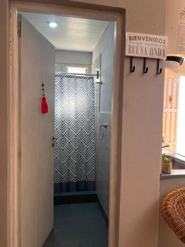 a bathroom with a shower with a glass door at Deptos Los Alerces in General Villegas