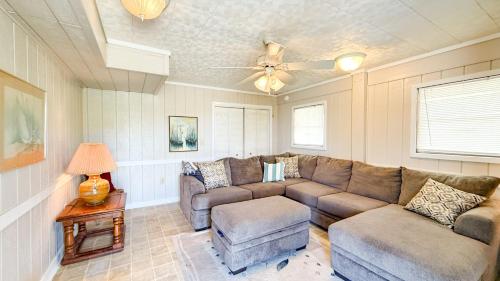 a living room with a couch and a ceiling fan at 8720 - Beach Please (Frisco) in Frisco