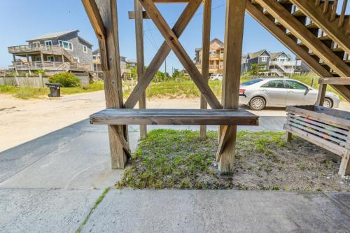 a wooden bench sitting on the side of a street at 8720 - Beach Please (Frisco) in Frisco