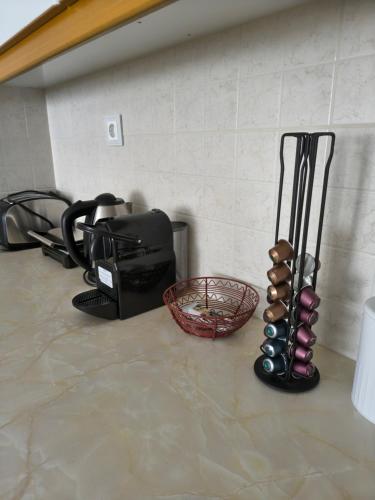 a kitchen counter with a mixer and a basket of eggs at The cozy seaside apartment in Nafpaktos