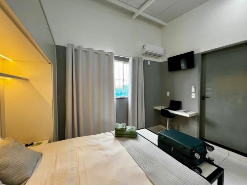 Ένα ή περισσότερα κρεβάτια σε δωμάτιο στο Loft Ferruginosa - 800m do Parque das Águas