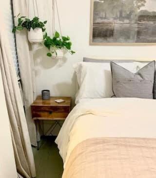 a bedroom with a bed and a nightstand next to a bed sidx sidx sidx at Lafayette Hideaway - Private Room with Kitchen & Parking in Lafayette