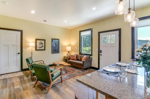 a living room with a table and chairs at 2 Mi to Dtwn Palmer Custom Valley Home with Garage in Palmer