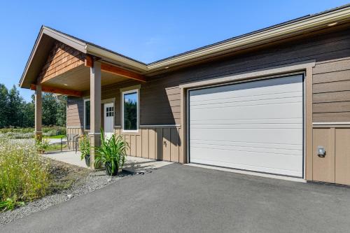 a house with a white garage door at 2 Mi to Dtwn Palmer Custom Valley Home with Garage in Palmer