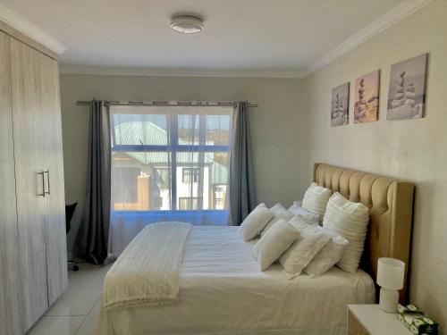 Katil atau katil-katil dalam bilik di Apartment in Roodepoort