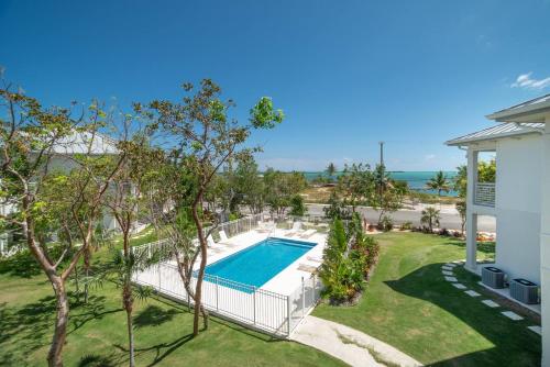 an overhead view of a swimming pool at a house at Seamist 308 Views Of North Sound in West Bay