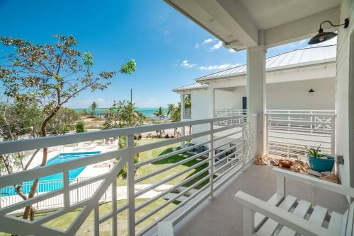 a balcony with a view of the ocean at Seamist 308 Views Of North Sound in West Bay