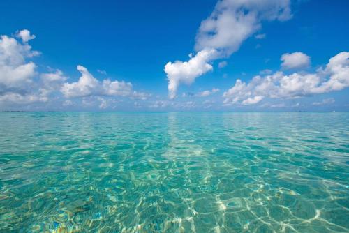 a view of the clear water in the ocean at Windsong #2 Beautiful Boggy Sand Beach, Smb in West Bay