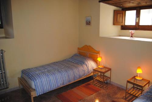 Ένα ή περισσότερα κρεβάτια σε δωμάτιο στο Agriturismo Podere Omomorto