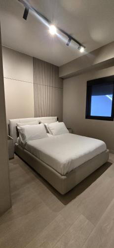 a bedroom with a large bed and a television at La Residence Panamá in Panama City