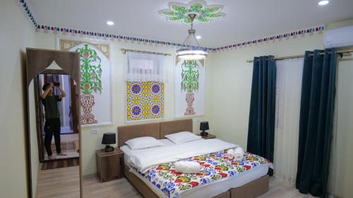 Ένα ή περισσότερα κρεβάτια σε δωμάτιο στο EVERLAND Guest House