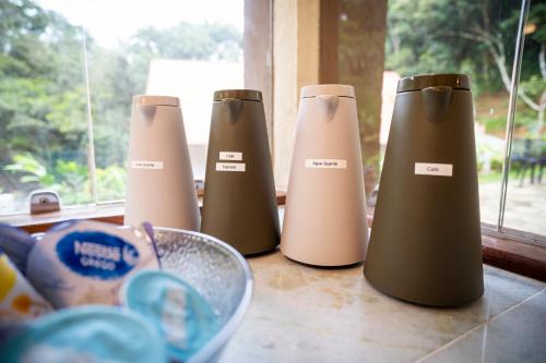 a group of three heaters sitting on a counter at Pousada Café Brasil in Guaramiranga