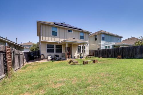 a house with a fence in a yard at Family Home with Pool Access 5 Mi to Downtown Buda! in Buda