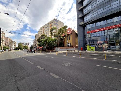 an empty street in the middle of a city at Dacia Residence Apartments in Bucharest