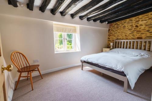 Postel nebo postele na pokoji v ubytování Newport cottage