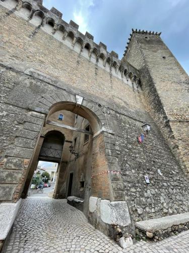 an entrance to a brick building with an archway at Rome Castle House with Meals Wine and Spirits in Civitella San Paolo