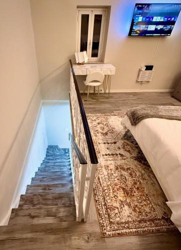 a room with a staircase leading to a bedroom at Rome Castle House with Meals Wine and Spirits in Civitella San Paolo