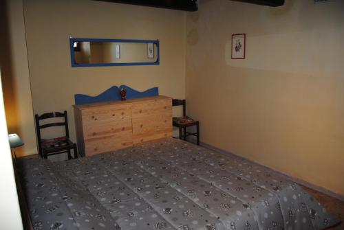 Ένα ή περισσότερα κρεβάτια σε δωμάτιο στο Agriturismo Podere Omomorto