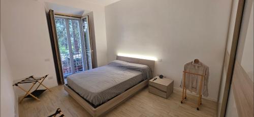 Ένα ή περισσότερα κρεβάτια σε δωμάτιο στο Al pozzo di Garibaldi