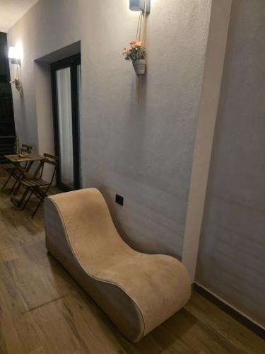 a chair sitting on the floor in a room at Chronos Villa Golem, Durrës in Durrës