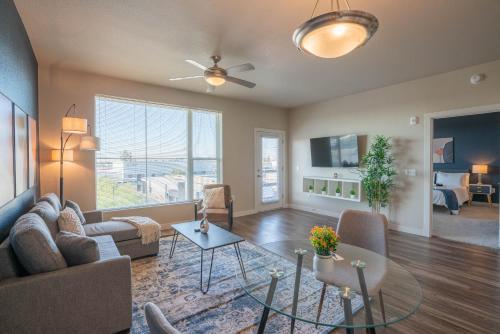 a living room with a couch and a table at Stylish 1BD - Balcony, Pool, Gym, W-D - Sleeps 4 in Tempe