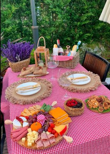 a picnic table with food and baskets of food at Pamera Garden Hotel in Kılıçlı
